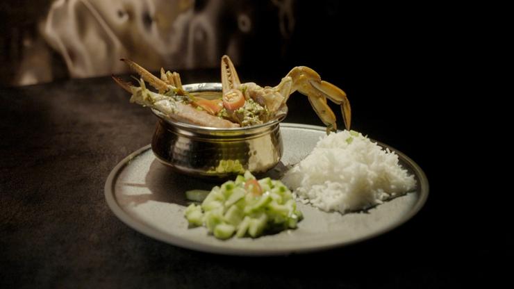 Chilli Masala Crab with Rice, Cumber & Onion Salad.