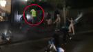 CCTV shows the gang of teenagers circle the delivery rider, throwing bottles and yelling before he flees.