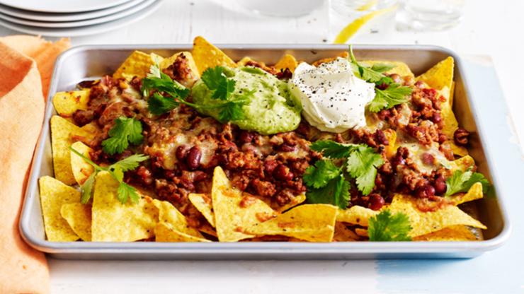 Courtney Roulston whips-up nachos in the Sunrise kitchen. 