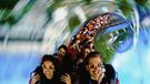 Thrillseekers enjoying a rollercoaster.