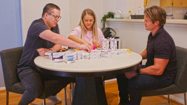 Denham Hitchcock with Johnny and Tahnee and the array of medication Johnny needed to take. 